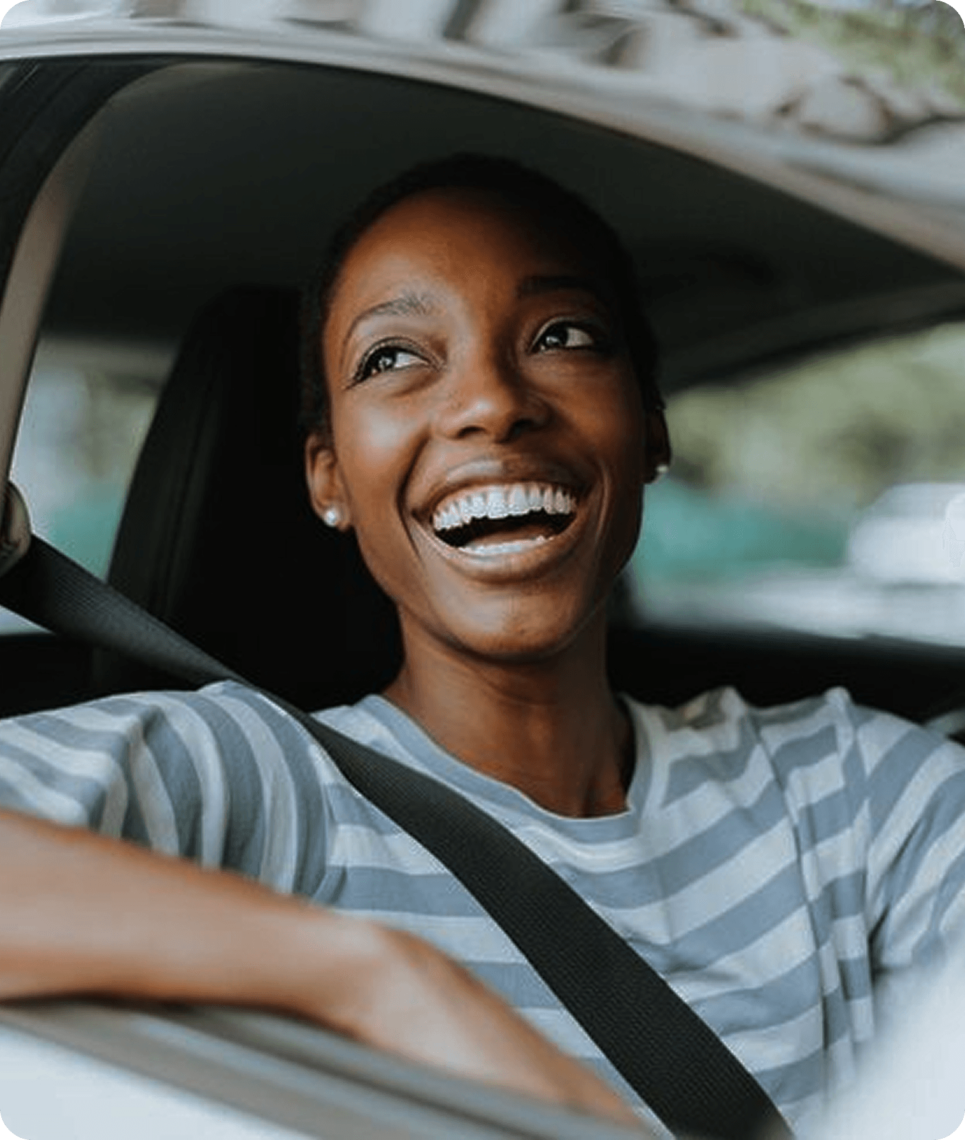 Smiling Woom driver behind the wheel
