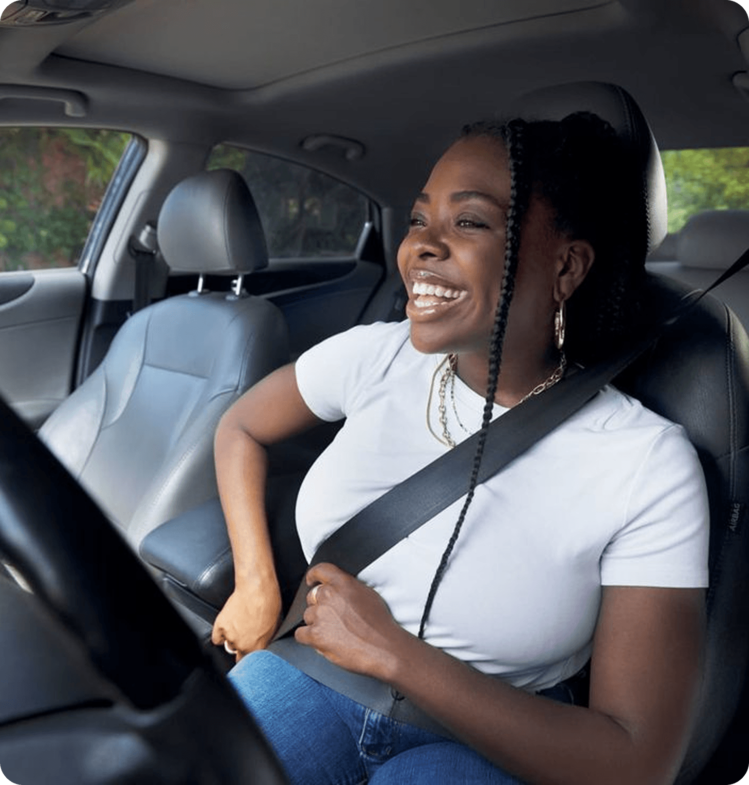 Happy woman buckling up for a safe journey